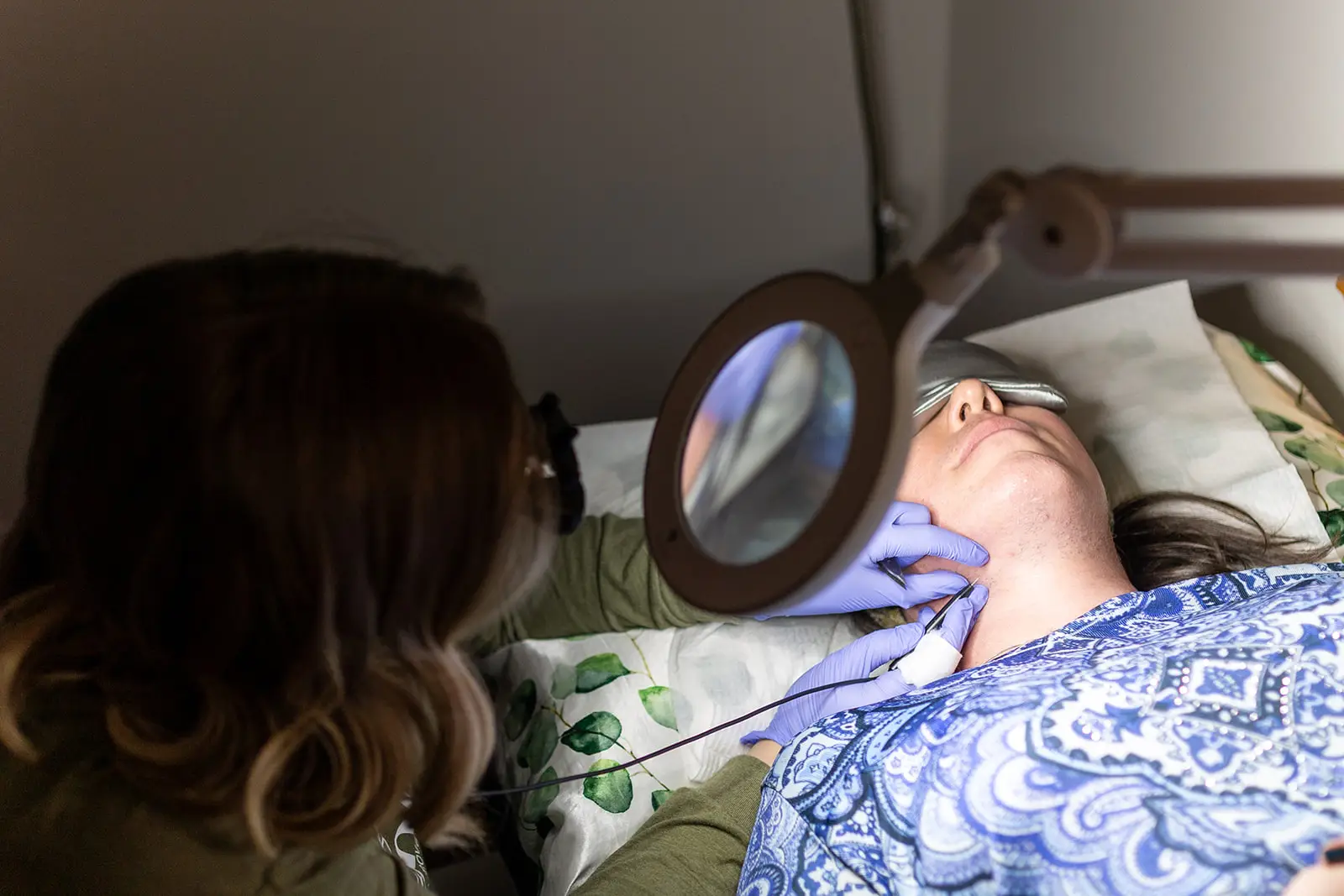Ober Yahr Electrolysis owner, Jamie Ober, provides electrolysis treatment on patient