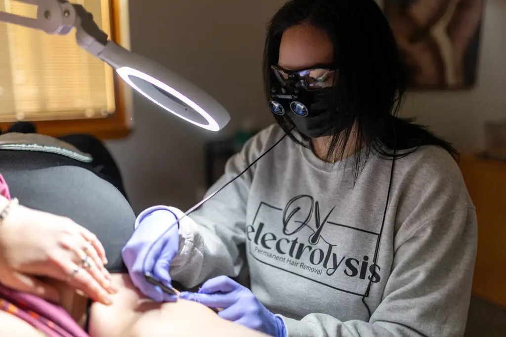 Ober Yahr Electrolysis employee performing hair electrolysis procedure on patient